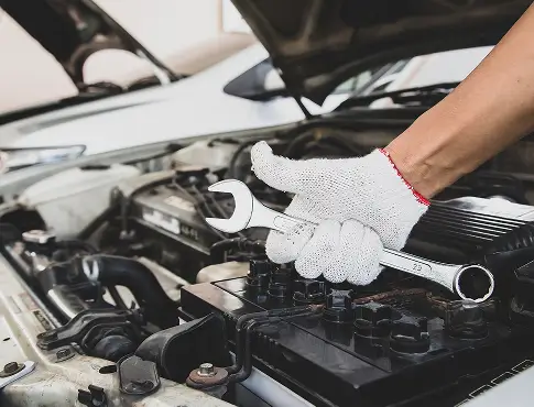 close-up-hand-auto-mechanic-is-using-wrench-repair-car-engine-1